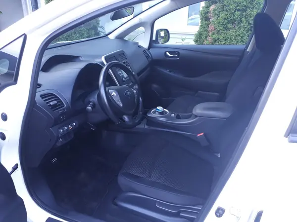 Detailed hatchback front cabin with dark cloth seats