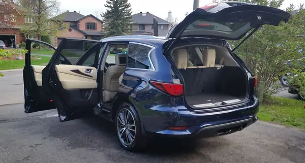 Detailed SUV with the tailgate open in a driveway